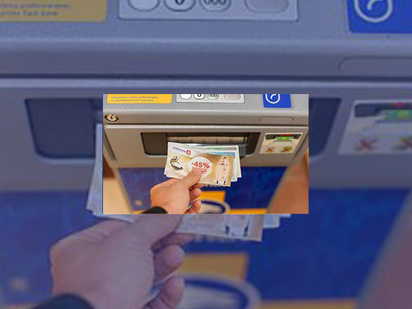 A photo showing someone receiving a coupon with their cash from a Euronet ATM
