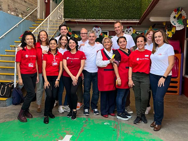 A photo of Ria employees with Save the Children officials in Mexico
