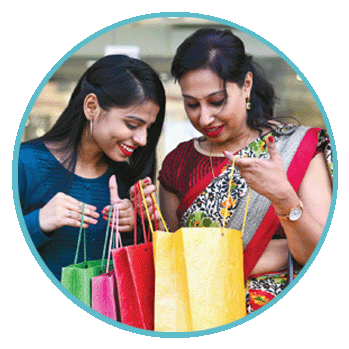 A photo of two women looking at what they bought with their Prezzy card
