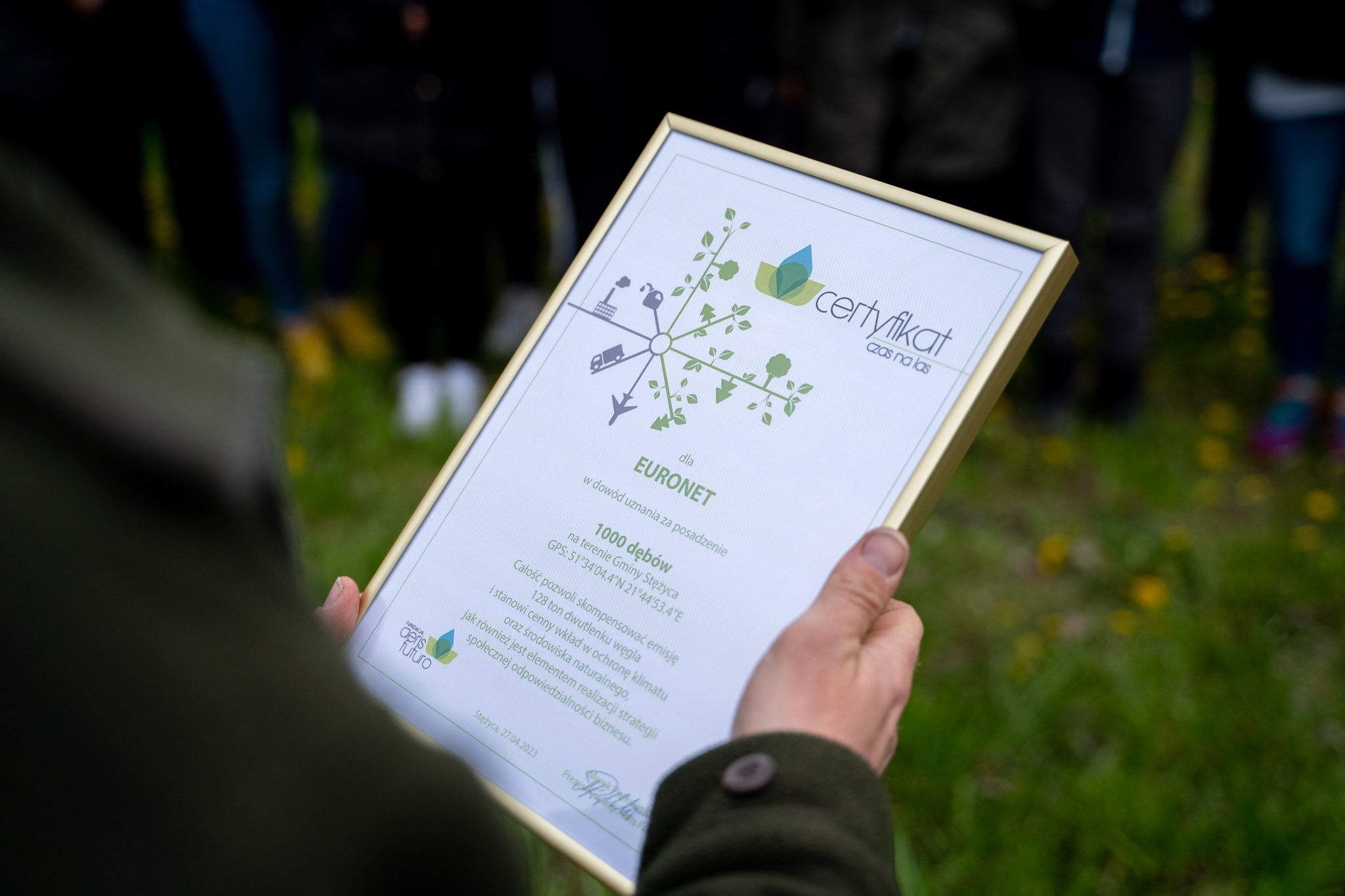 Photo of Euronet Poland team members planting trees