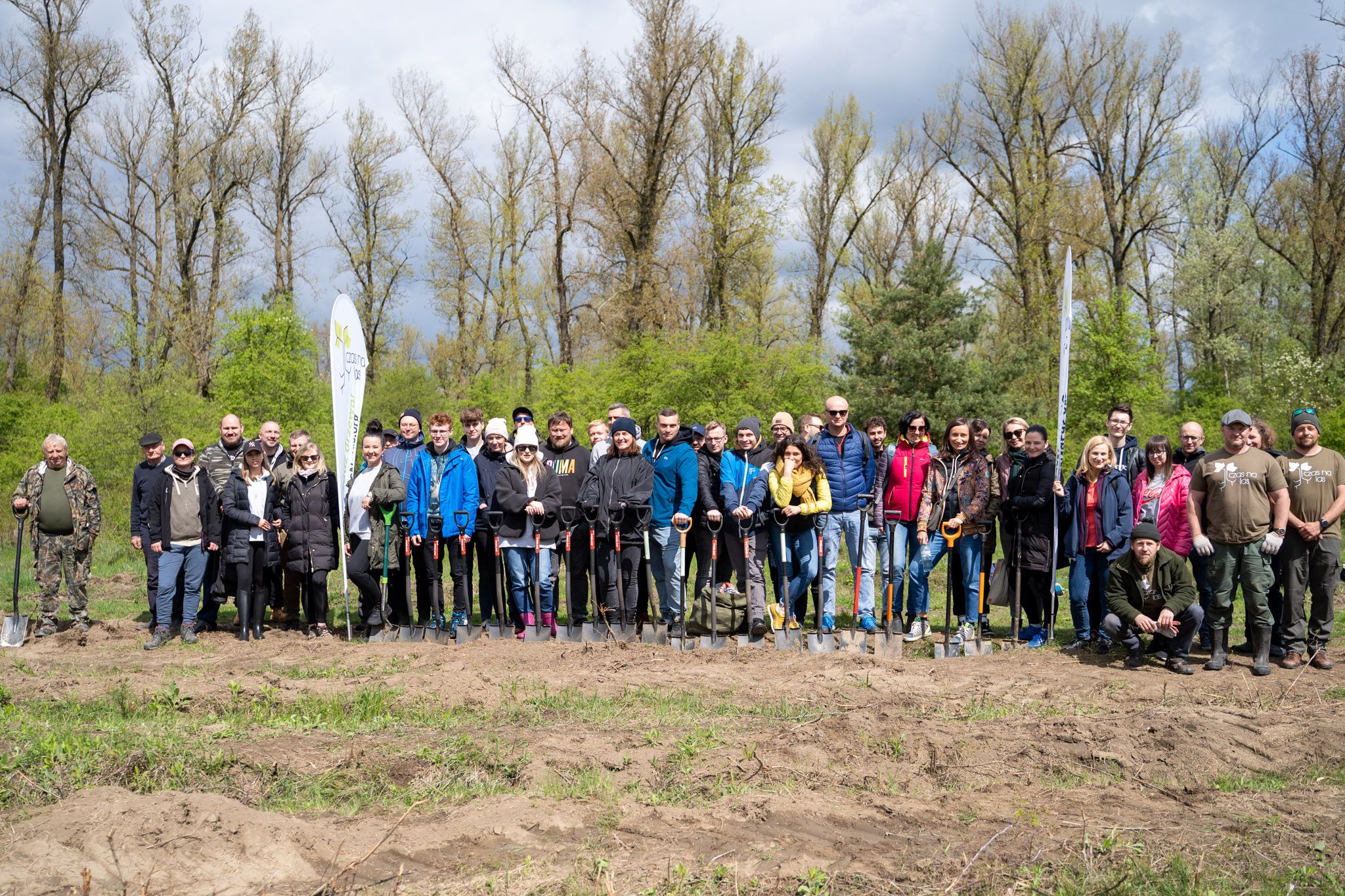 Photo of Euronet Poland team members planting trees