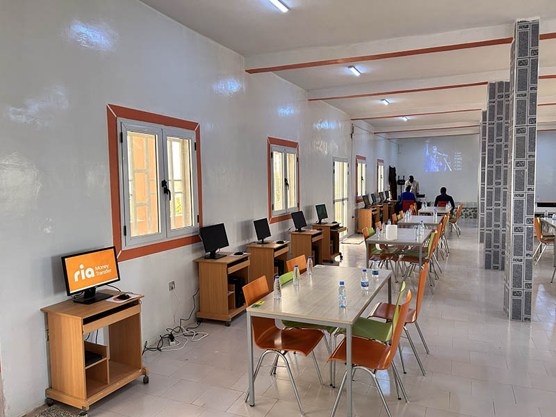 Ria team celebrating with students and locals at the inauguration of Bargny High School’s new computer room in Senegal.