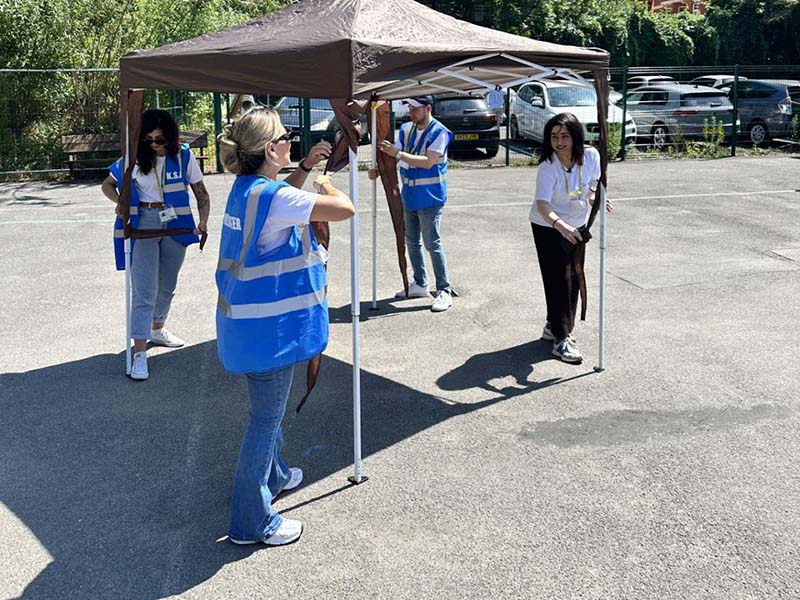 Euronet employees volunteering at King Solomon Academy summer fair in London