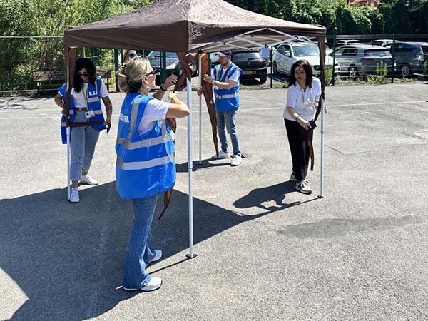 Euronet employees volunteering at King Solomon Academy summer fair in London