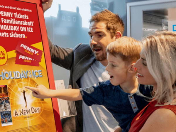 Family buying concert tickets from an epay kiosk at a retailer
