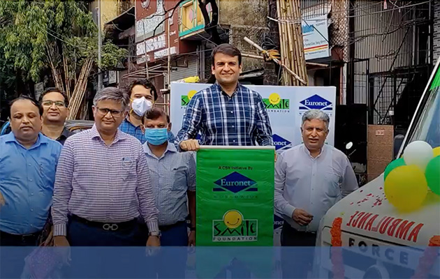 Photo of Euronet employees in India donating a mobile hospital